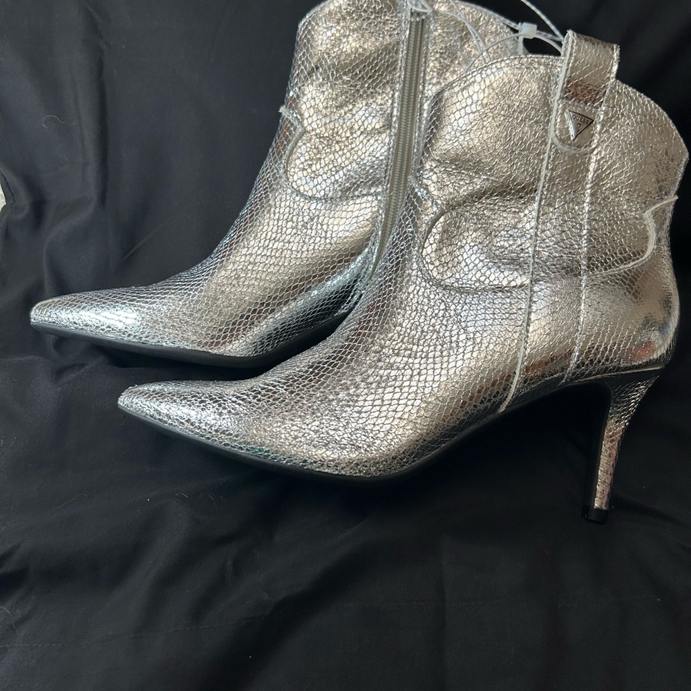 Metallic silver boots , brand Guess ,size 8 1/2M comfortable and sexy